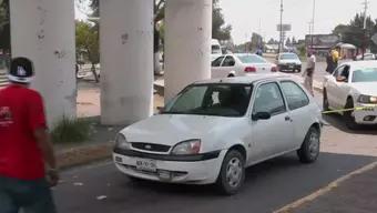 Carro acordonado en balacera