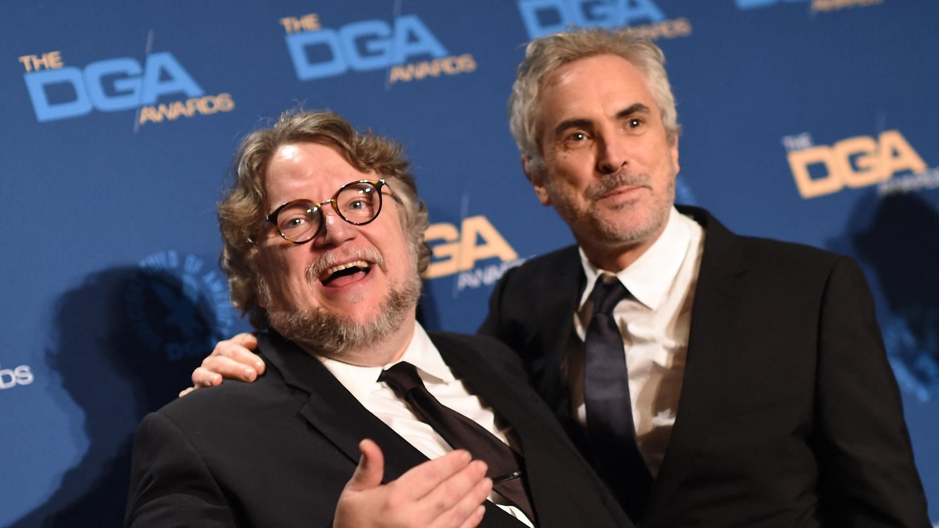 Guillermo del Toro y Alfonso Cuarón en una alfombra roja